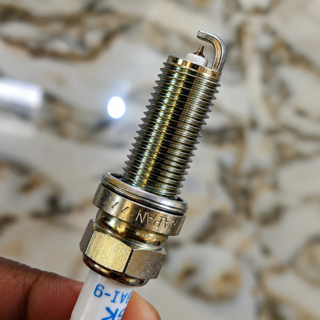 NGK Laser Iridium LKAR8AI-9 spark plug featuring a fine iridium center electrode and threaded metal body