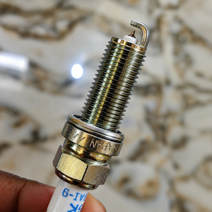 NGK Laser Iridium LKAR8AI-9 spark plug featuring a fine iridium center electrode and threaded metal body