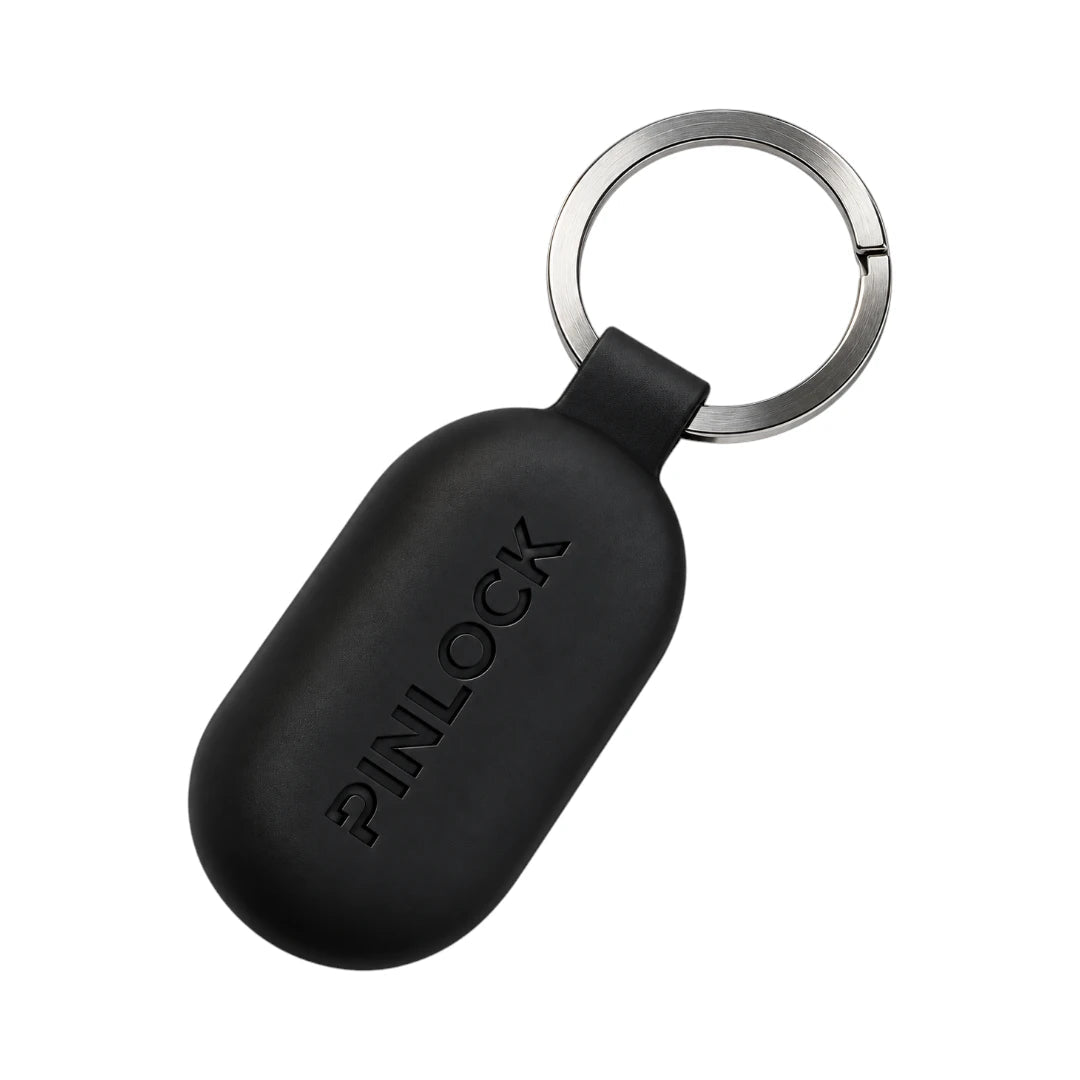 Black Pinlock earplug storage case with a metal keyring for motorcycle riders