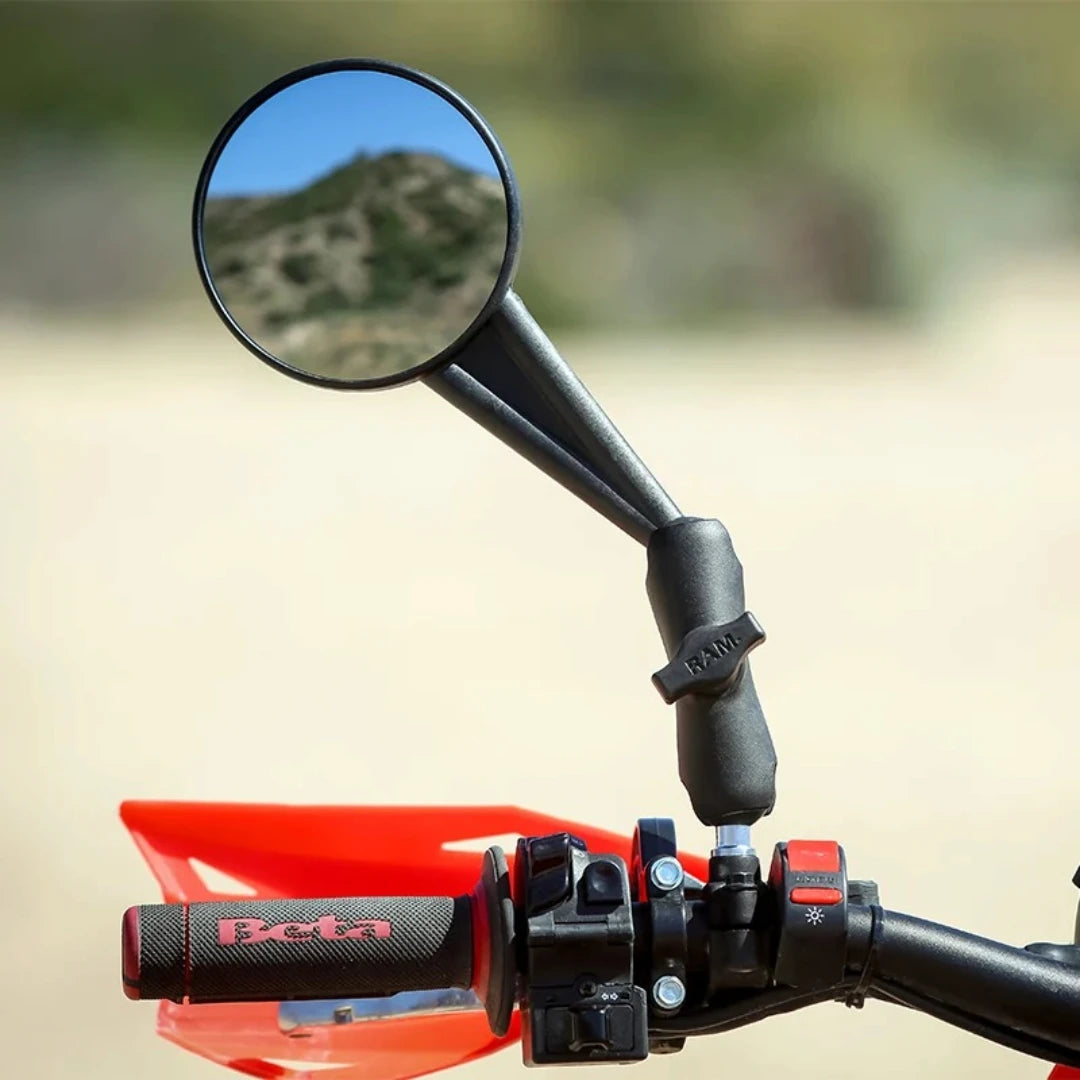 RAM Mounts M10 threaded ball adapter installed on a motorcycle handlebar mirror mount with a socket arm