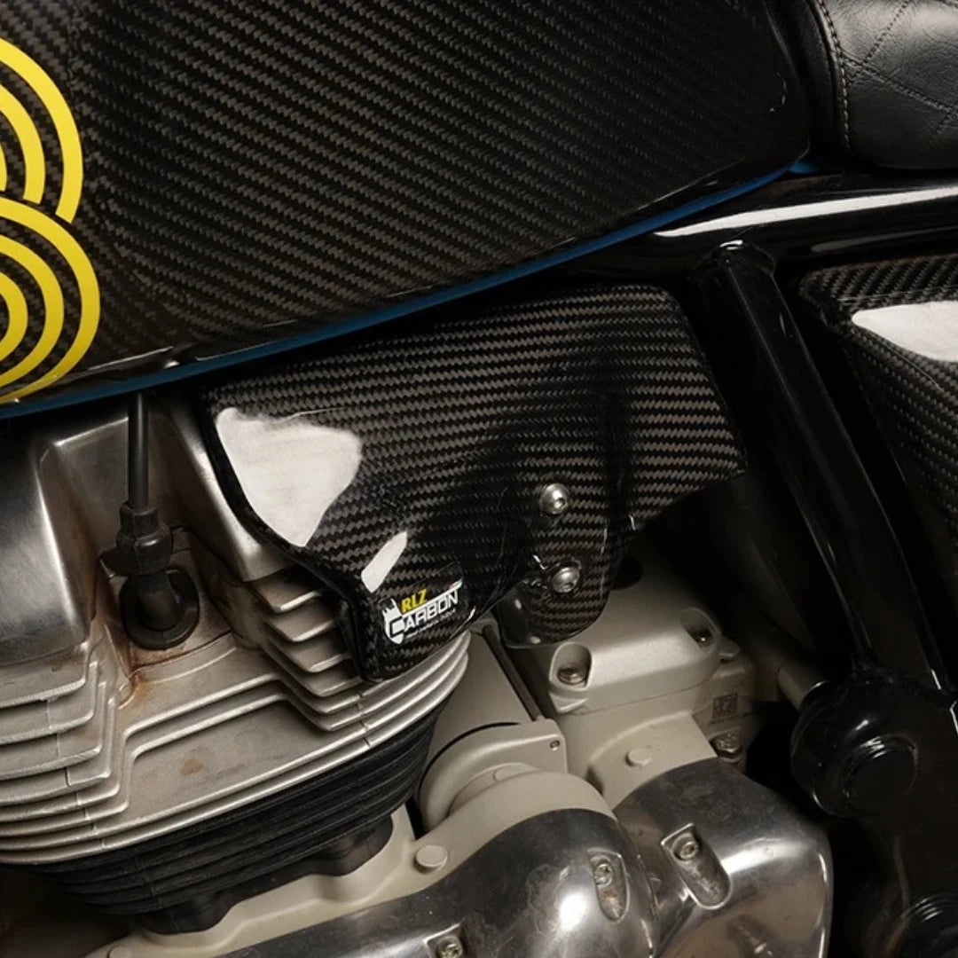 RLZ twill gloss carbon fiber heat shield installed on a Royal Enfield Interceptor 650 engine side cover.