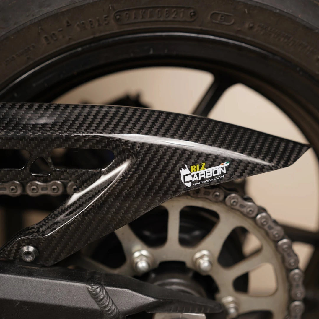 RLZ carbon fiber rear hugger with integrated chain guard in a glossy twill finish for Kawasaki Z900.