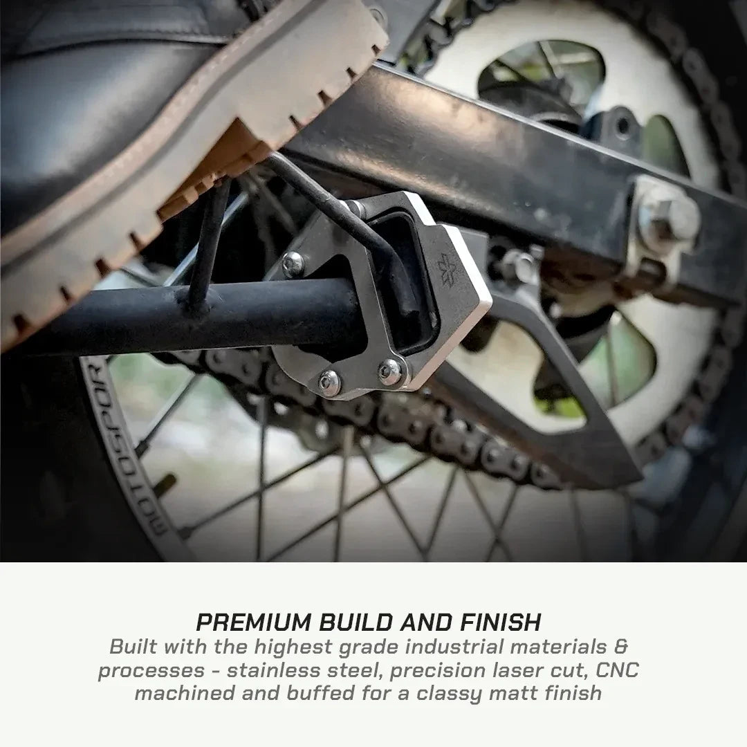 ViaTerra stainless steel side stand shoe installed on a Hero XPulse 210 motorcycle for improved stability.