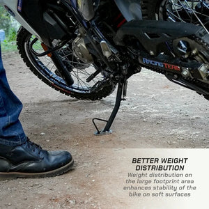 ViaTerra side stand shoe installed on a Hero XPulse 210, providing stability on soft ground.